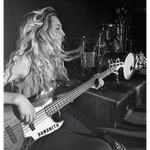 Cariies playing bass back in the day photo.