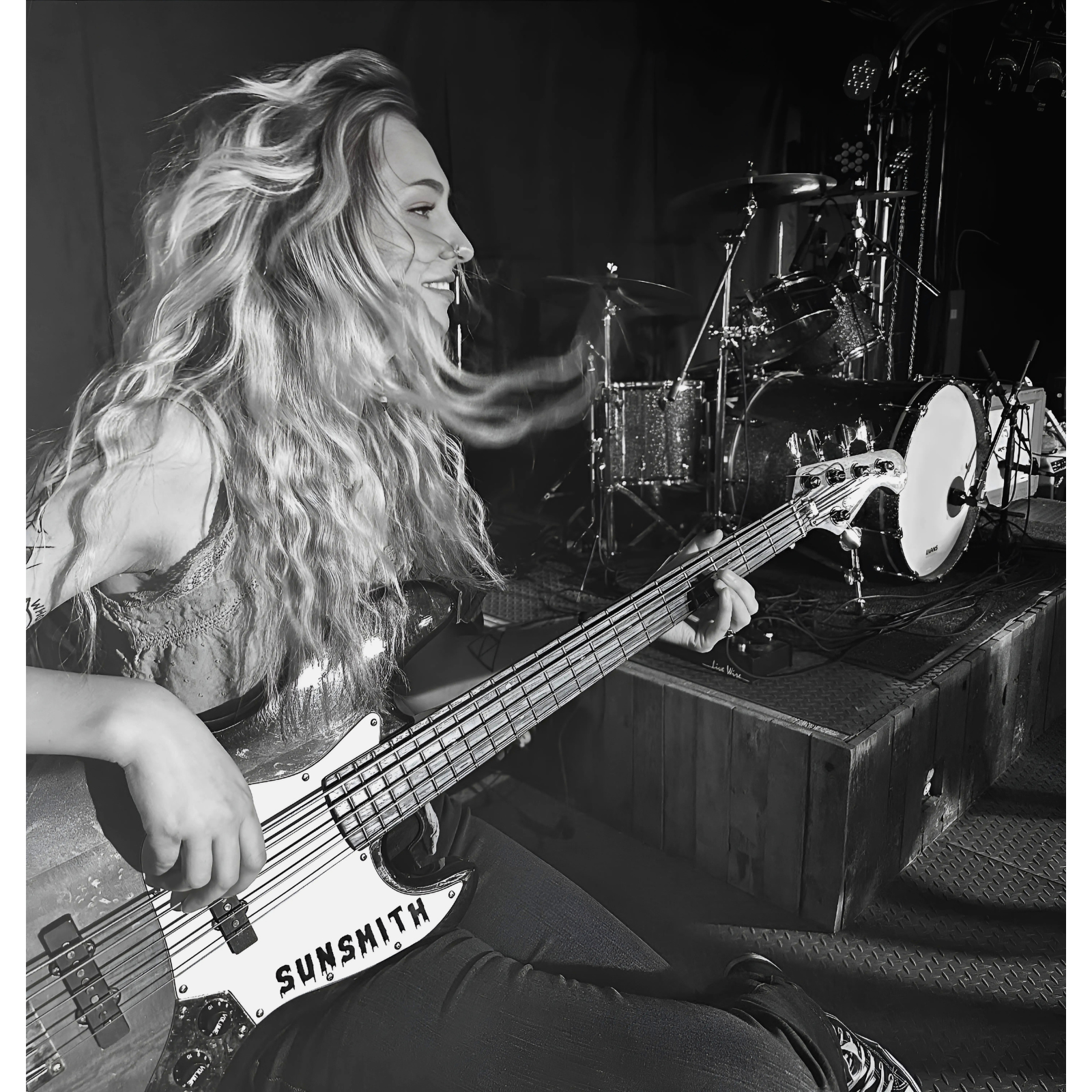 Cariies playing bass back in the day photo.