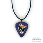 Close-up of Into the Night necklace showing high-gloss epoxy finish with gold pendant and bold festival colors.