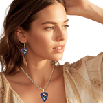 GRF – Into the Night necklace on model featuring glossy navy guitar pick design with bird and Steal Your Face artwork.