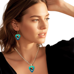 GRF – Ocean Flight Necklace on model featuring teal glossy guitar pick design with the Golden Road Festival bird and Steal Your Face artwork.