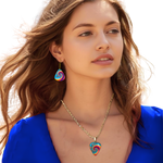 GRF – Psychedelic Flight guitar pick jewelry set with glossy epoxy top coat and colorful Golden Road Festivalbutterfly spiral design.