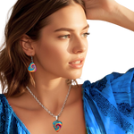 GRF – Psychedelic Flight guitar pick necklace with glossy epoxy top coat and colorful Golden Road Festival butterfly spiral design.