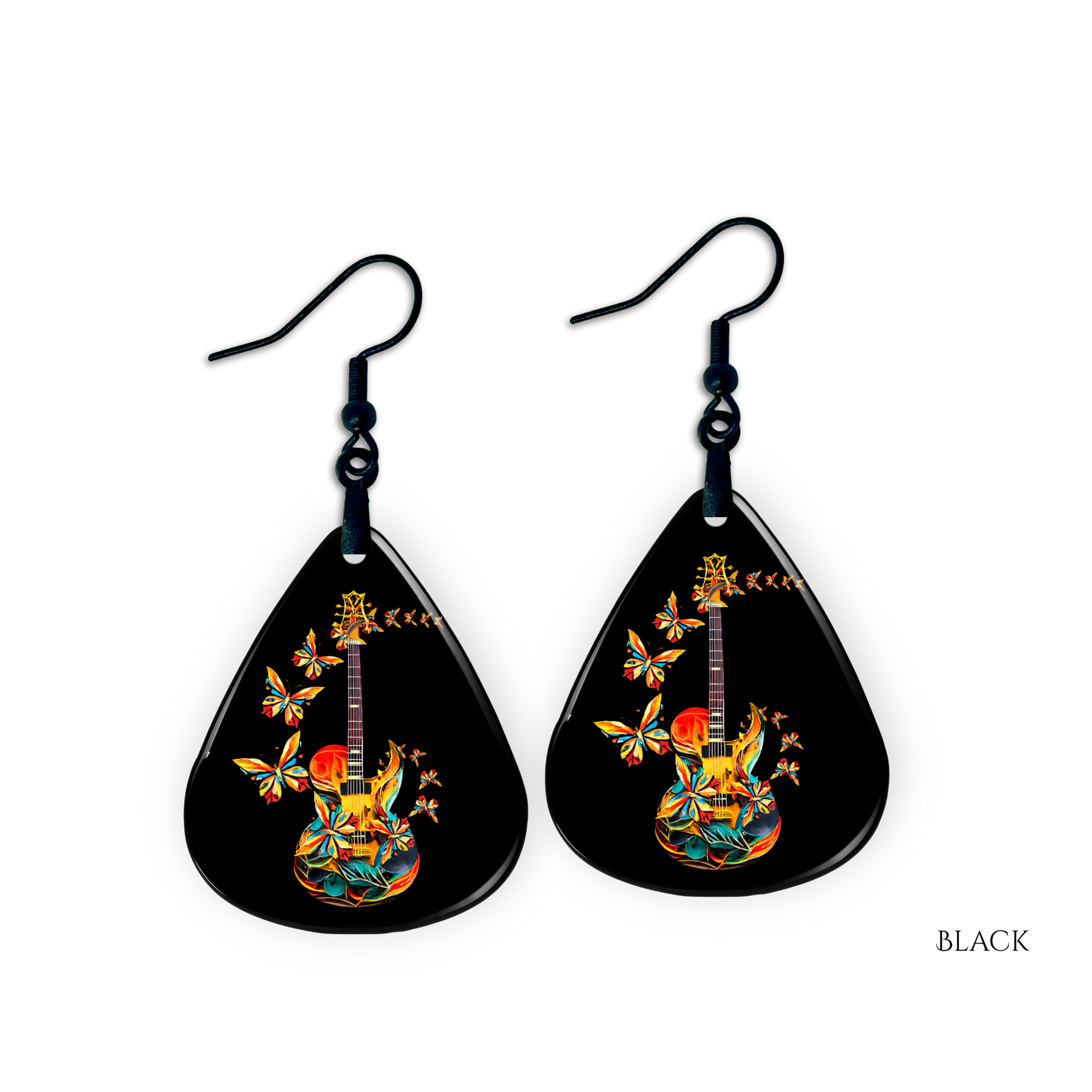 Close-up of handcrafted Stella’s Flight earrings showing vibrant butterfly-and-guitar artwork under a glossy epoxy finish.