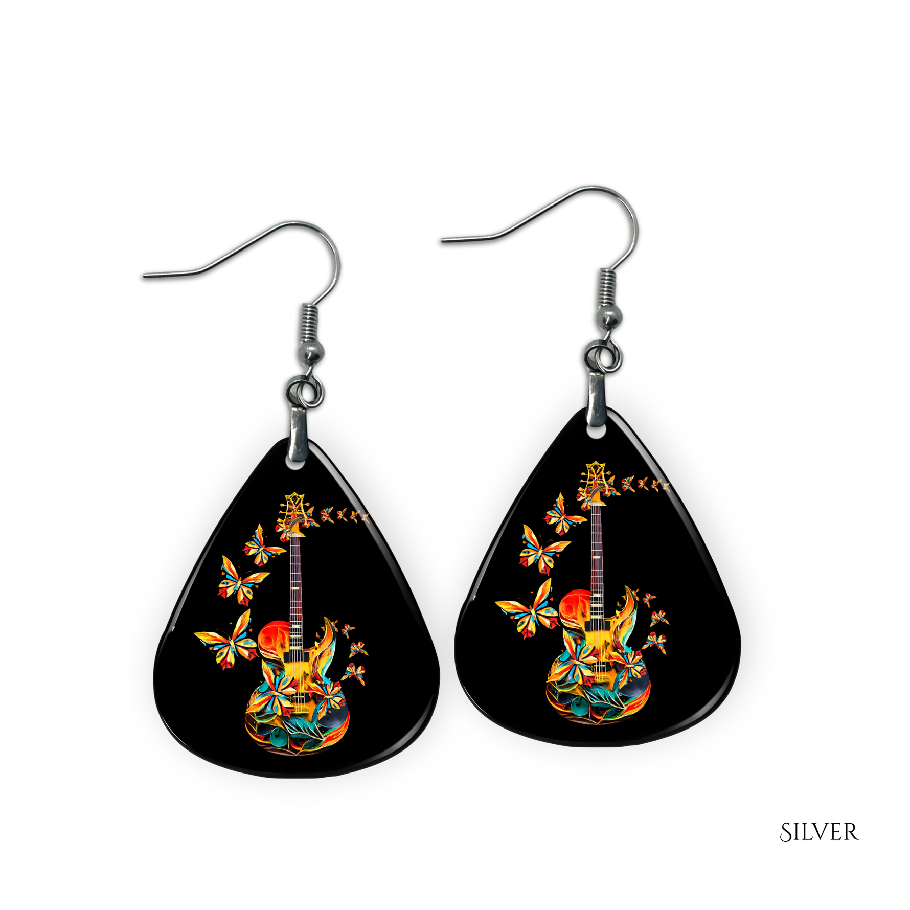 Close-up of handcrafted Stella’s Flight earrings showing vibrant butterfly-and-guitar artwork under a glossy epoxy finish.