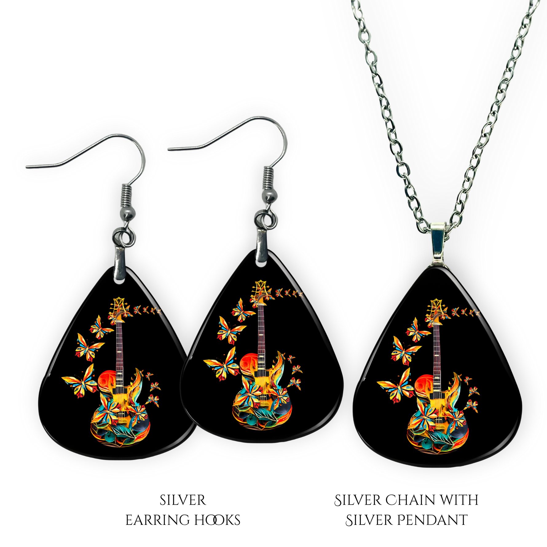 Close-up of handcrafted Stella’s Flight earrings and necklace pendant set showing vibrant Golden Road Festival butterfly-and-guitar artwork under a glossy epoxy finish.