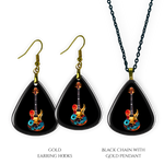 Necklace earrings and pendant set from GRF – Stella’s Jam collection with multicolor guitar design and high-shine finish.