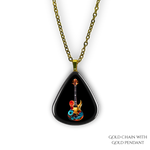 Close-up of Stella’s Jam necklace showing glossy black guitar pick design with vivid guitar art.