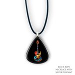 Close-up of Stella’s Jam necklace showing glossy black guitar pick design with vivid guitar art.