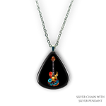 Close-up of Stella’s Jam necklace showing glossy black guitar pick design with vivid guitar art.