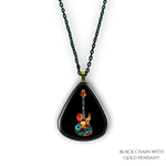 Close-up of Stella’s Jam necklace showing glossy black guitar pick design with vivid guitar art.